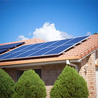 Solar panels on a residential roof in Jaipur, Rajasthan, promoting the use of solar energy for a greener future