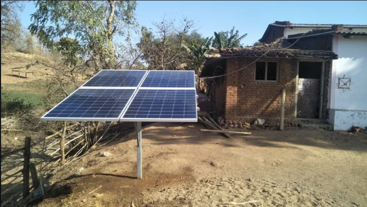 A solar panel setup in front of a residential home in Jaipur, Rajasthan, representing a small-scale solar energy project.